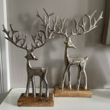 Brushed Silver Reindeers with large antlers on Wooden Base Available in 2 sizes; 23cm & 30cm