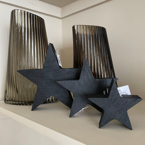 A chunky wooden star made from mango wood. Complete with a black painted finish with visible wood grain. Available in 3 sizes; small 10cm, medium 15cm & large 20cm