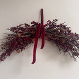 Festive hanging decoration with deep red &amp; burgundy berries with natural twigs &amp; pinecones and matching velvet ribbon bows 60cm