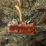 Fun Christmas ceramic Hanging Decoration
Chocolate log with a smiling face and holly 6cm