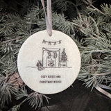 Small gifts with a meaningful quote at Christmas&nbsp;
Small white Marble round hanging flat disc 7cm
Black Text Quote - 'Cosy kisses and Christmas wishes'&nbsp;
Image - Open fire surround, stockings hanging, presents at the side &amp; a christmas tree with holly above...&nbsp;