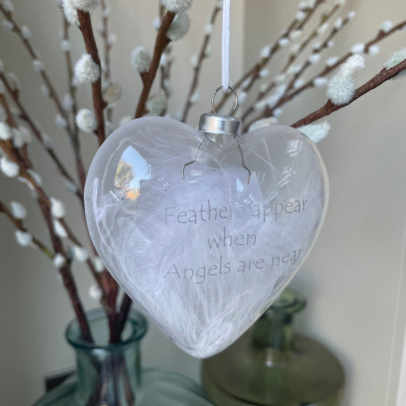 Heart shaped Glass Bauble 10cm filled with feathers with the quote;  Feathers appear when angels are near