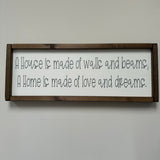 Made in the UK by Giggle Gift Co Rectangular L63.5cm Framed quotable Plaque in old white vinyl; 'A house is made of walls and beams, a home is made of love and dreams.'