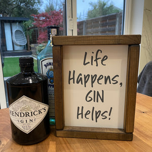 Made in the UK by Giggle Gift co. Small Rectangular H24cm Framed Plaque with Cream vinyl & grey text "Life Happens, Gin Helps!"