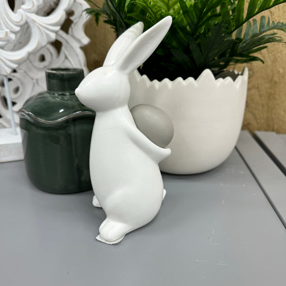 Matte White Rabbit Holding a Grey Egg