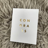 Chalk UK Card Collection - Simple designs but classy     White card 118x90mm, blank inside for your own personal message;  Gold text quote - 'CONGRATS' 