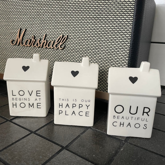Stylish White Glossy Porcelain Small Houses with heart motif H9cm Each one has a different simple meaningful home quote; Small House - Size approx 9 x 6 x 4.5cm  Love Begins at Home  | PL025854 This is our Happy Place  |  PL025853 Our Beautiful Chaos  |  PL025856