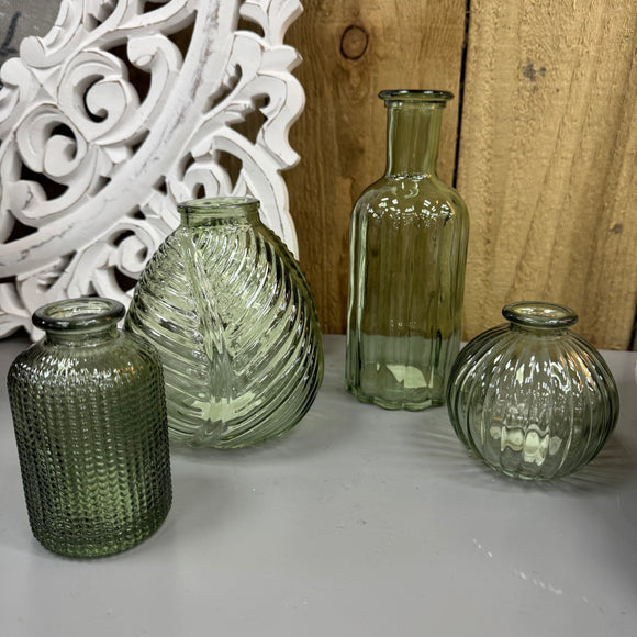 Vintage Green Small Glass Bottle Vases
Various styles
Round Ribbed H8.3 x Dia 8.4cm  
Leaf pattern H13 x Dia 11cm 
Tall ribbed H19 x D7.5cm

Small Dimpled H10 x D6.3cm