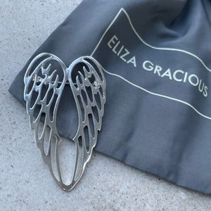 Eliza Gracious - quality affordable design led branded costume jewellery.  Brooch Twin Angel Wing Available in Matt silver & Pale Gold