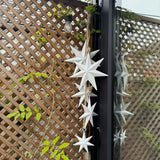 Hanging white metal bunch of Stars