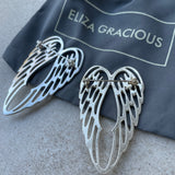 Eliza Gracious - quality affordable design led branded costume jewellery.  Brooch Twin Angel Wing Available in Matt silver & Pale Gold