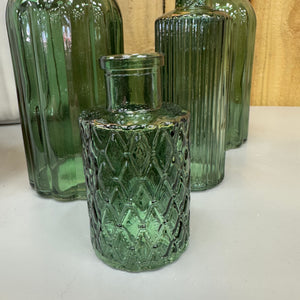 Dark Forest Green Small Glass Bottle Vases
Various styles
Mini Geometric H9.2 x Dia 5cm&nbsp;
Tall slim H13.2 x Dia 5.2cm
Ribbed H10 x D5cm
Tall Ribbed H19 x D8cm&nbsp;
Small Squared patterned Vase H9.2 x D5cm