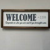 Made in the UK by Giggle Gift Co Rectangular L63.5cm Framed quotable Plaque in old white vinyl; "WELCOME-ish. Depends on who you are and if you brought wine.