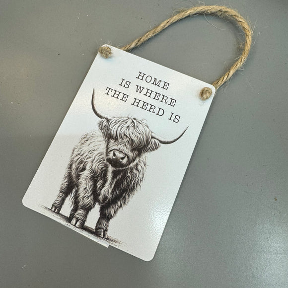 Mini Metal Hanging Sign 9cm with cute quote:
'Home is where the Herd is' with a highland cow illustration