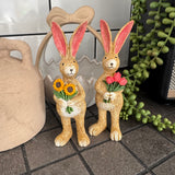 Ruth Rabbit holding bunch of Tulips