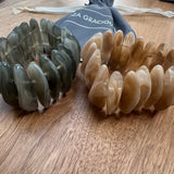 Eliza Gracious quality - affordable design led branded costume jewellery.

Slim polished smooth resin pieces forming a resin stretch bracelet&nbsp;

Available in 2 colours; Cream &amp; Grey