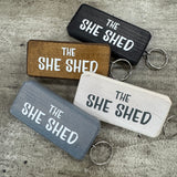 Made in the UK by Giggle Gift Co.
Wooden block keyring with white text quote on both sides;
'The&nbsp;She Shed'&nbsp;