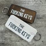 Made in the UK by Giggle Gift Co.
Wooden block keyring with white text quote on both sides;
'The&nbsp;Fucking Keys'

&nbsp;BEST SELLER!!