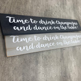 Long Wooden Hanging Plaque;
"Time to drink champagne and dance on the table!"

Made in the UK by The Giggle Gift co.