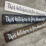 Made in the UK by The Giggle Gift co.
Long L59.5cm Wooden Hanging Plaque;
"This kitchen is for dancing!"