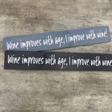 Long Wooden Hanging Plaque L59.5cm;
Wine improves with age, I improve with wine!&nbsp;

Made in the UK by The Giggle Gift co.