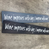 Long Wooden Hanging Plaque L59.5cm;
Wine improves with age, I improve with wine!&nbsp;

Made in the UK by The Giggle Gift co.