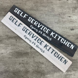 Made in the UK by The Giggle Gift co.
Long L59.5cm Wooden Hanging Plaque;
"Self Service Kitchen Open 24 hours"
