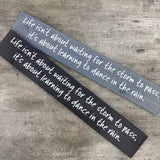 Made in the UK by The Giggle Gift co.
Long&nbsp;L59.5cm Wooden Hanging Plaque;
Quote - "Life isn't about waiting for the storm to pass, it's about learning to dance in the rain."