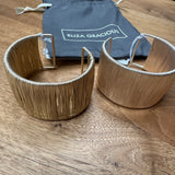 Eliza Gracious quality - affordable design led branded costume jewellery.

New SS26

Wire Wrapped Wide Cuff Slip on Bracelet
Available in 2 colours;&nbsp; Burnished Pale Gold &amp; Matt silver&nbsp;