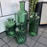 Dark Forest Green Small Glass Bottle Vases
Various styles to mix &amp; match and all sold individually
Mini Geometric H9.2 x Dia 5cm - £2.00
Tall slim H13.2 x Dia 5.2cm - £2.50
Small Ribbed H10 x D5cm - £2.50
Tall Ribbed H19 x D8cm - £5.00