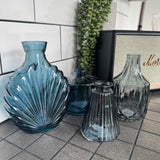 Blue&nbsp;Small&nbsp;Glass Bottle Vases
New styles to add to the collection; - all sold individually so you can mix &amp; match
Wide ribbed/diamond shape and narrow top H13.8cm - £5.00
Ribbed glass bottle W7.4 x H9.9cm - £2.50
Squat glass bottle H10.3cm - £4.00
Decorative fan bottle W13 x D6 x H17 cm - £5.00