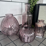 Amethyst Small&nbsp;Glass Bottle Vases
Various styles to mix &amp; match and all sold individually;
Round Ribbed H8.3 x Dia 8.4cm - £2.50
Leaf pattern H13 x Dia 11cm - £5.00

Small Ribbed - H10 x 5cm - £2.00
Tall Slim Ribbed&nbsp; H19 x Dia 7.5cm - £5.00
