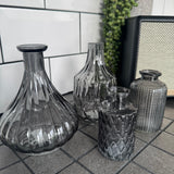 New Cool Grey Small Glass Bottle Vases
Various styles to mix &amp; match and all sold individually;
Diamond Shaped Small Vase H15 x W8cm&nbsp; - £5.00

Ribbed Wide Base Bud Vase H15 x W12cm&nbsp; - £5.00
Mini Geometric Bottle H9cm x Dia 5cm - £2.00
Small Dimpled H10 x 5cm - £2.00