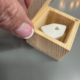 Radar&nbsp; - Lucky Wooden Small Box 4.5cm;
Quote engraved on the lid - HOME SWEET HOME
Inside the Box - Ceramic white small house with a gold heart