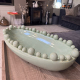 Caladon pale green Glazed Ceramic Oval Bowl 57x28cm with decorative small &amp; large raised spheres/bobble balls round the top rim&nbsp;