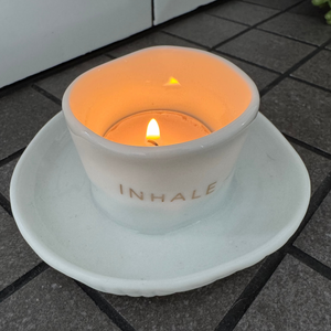 Radar Zen Spirit - Tealight Holder with plate&nbsp;
White Porcelain distorted round t-light holder secured to a dish
Quote in gold text - INHALE&nbsp; EXHALE REPEAT