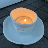 Radar Zen Spirit - Tealight Holder with plate&nbsp;
White Porcelain distorted round t-light holder secured to a dish
Quote in gold text - INHALE&nbsp; EXHALE REPEAT