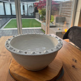 Off White Distressed Ceramic Bowl 34cm with a textured detail around the edge.