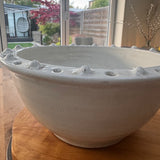 Off White Distressed Ceramic Bowl 34cm with a textured detail around the edge.