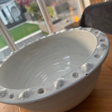Off White Distressed Ceramic Bowl 34cm with a textured detail around the edge.
