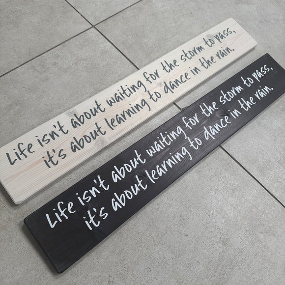 Long Wooden Hanging Sign - 'Life isn't about waiting for the storm..'