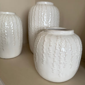 Off White / Cream Glazed Vertical hanging pattern Vases&nbsp;
Available in 3 sizes; Small H18cm, Medium H24cm &amp; Large H29cm&nbsp;

These off white / cream glazed distressed effect ceramic vases have a stylish vertical design; similar to the hanging string of pearls plant all at different lengths and depth