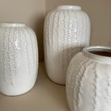 Off White / Cream Glazed Vertical hanging pattern Vases&nbsp;
Available in 3 sizes; Small H18cm, Medium H24cm &amp; Large H29cm&nbsp;

These off white / cream glazed distressed effect ceramic vases have a stylish vertical design; similar to the hanging string of pearls plant all at different lengths and depth