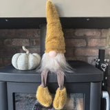 Sitting Fabric Gonk with a faux fur Ochre hat &amp; boots and Brown body &amp; legs H32cm