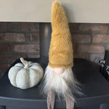 Sitting Fabric Gonk with Warm Ochre/brown tones