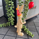 Ruth Rabbit holding a Red Balloon