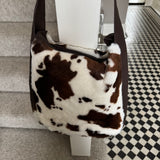 Faux Fur Bag with leather detail & strap - Cow print