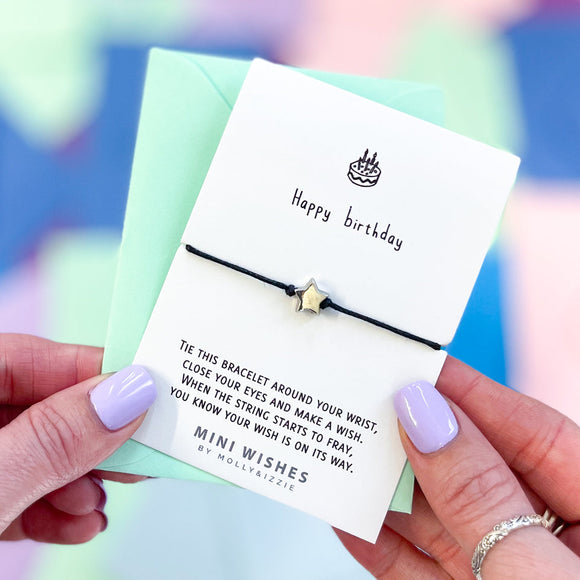 Mini Wishes by Molly & Izzie Cotton cord bracelet with a star bead presented on a card with the quote; 'Happy Birthday' 