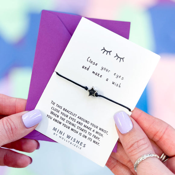 Mini Wishes by Molly & Izzie Cotton cord bracelet with a star bead presented on a card with the quote; 'Close your eyes and make a Wish' 