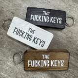 Made in the UK by Giggle Gift Co.
Wooden block keyring with white text quote on both sides;
'The&nbsp;Fucking Keys'

&nbsp;BEST SELLER!!